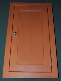 narrow medicine cabinet in pumpkin with paneled door