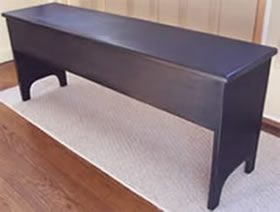 Black, slightly distressed, storage bench