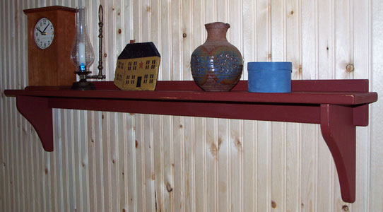 Wall shelf in destressed barn red